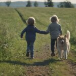 children and dog playing